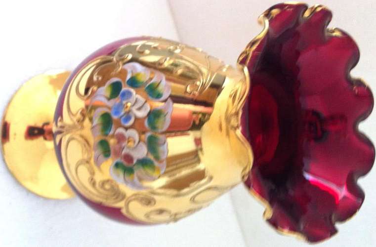 COLLECTABLE BOHEMIAN VASE, PIGEON BLOOD RED WITH EMBOSSED FLOWER DESIGN AND GOLD GILT
