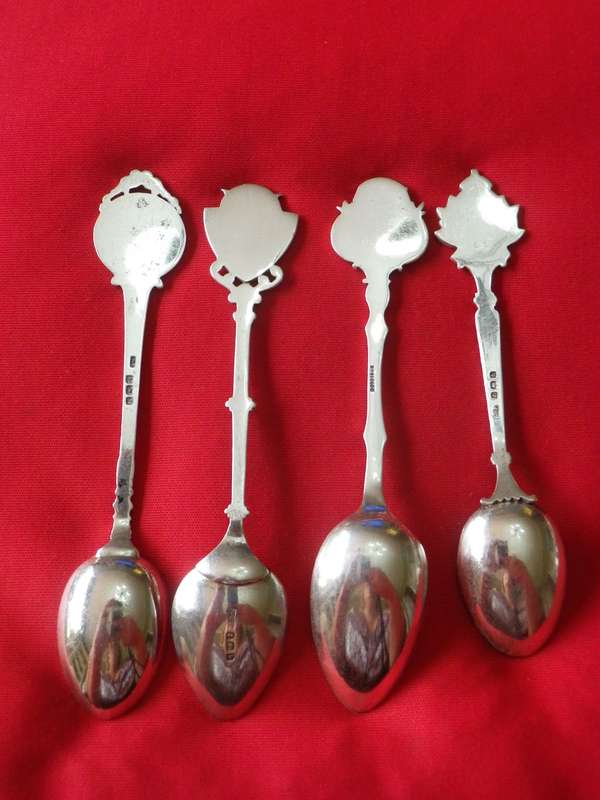 BRITAIN + GB EMPIRE - 4 X SILVER PLATE SHOOTING TEASPOONS          (8355)