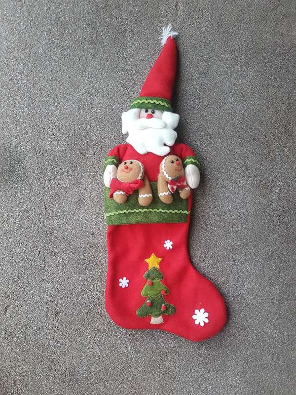 Cute Father Christmas stocking Closes with a zip at the back