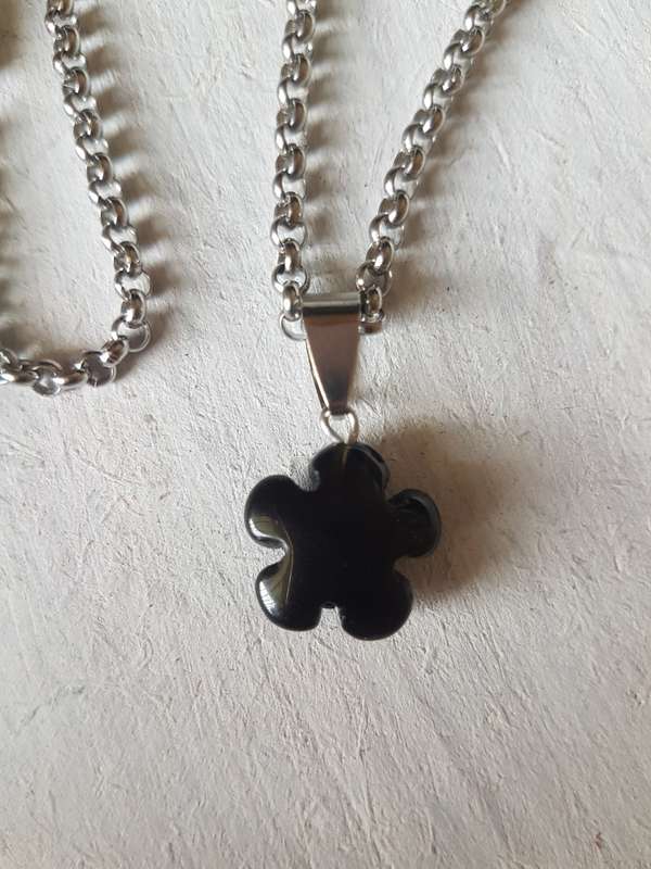 Stainless steel necklace with natural black onyx flower pendant