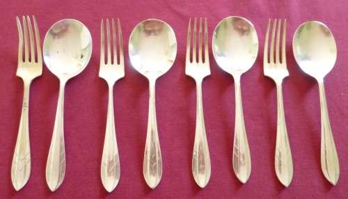 Set of four silver plated ice-cream spoons and forks