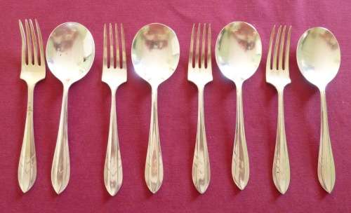 Set of four silver plated ice-cream spoons and forks