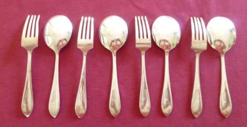 Set of four silver plated ice-cream spoons and forks