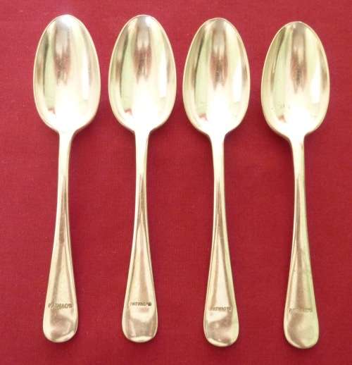 Set of four silver plated dessert spoons