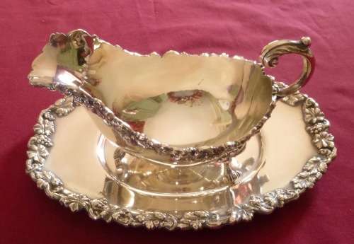 Dramatic silver plated sauce boat on stand