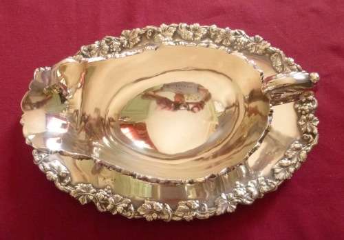 Dramatic silver plated sauce boat on stand
