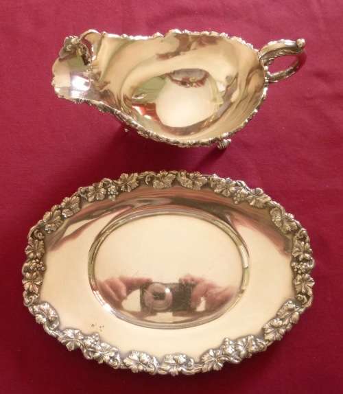 Dramatic silver plated sauce boat on stand