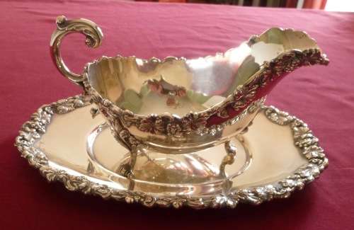 Dramatic silver plated sauce boat on stand