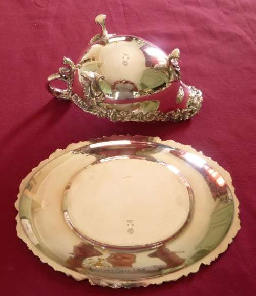 Dramatic silver plated sauce boat on stand