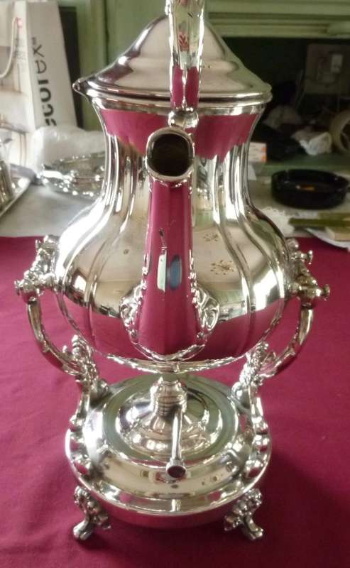 Silver plated tea kettle on stand
