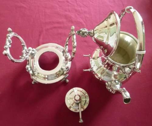 Silver plated tea kettle on stand