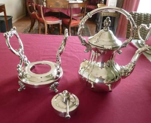 Silver plated tea kettle on stand