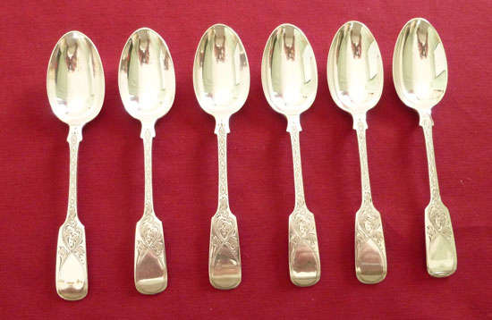A superb set of Edwardian silver large teaspoons