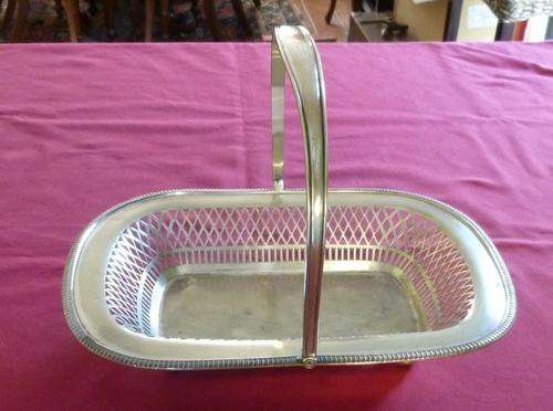 Large silver plated swing handled basket