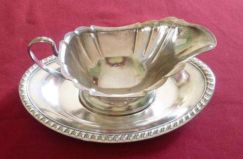Silver plated sauce boat on stand