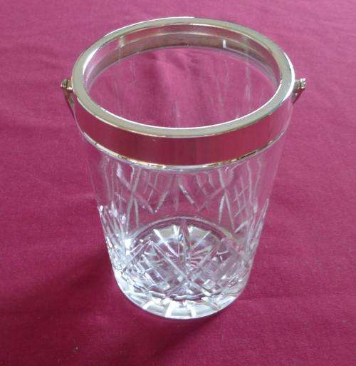 Cut crystal ice bucket with silver plated collar