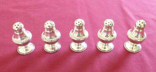 Set of five silver peppers