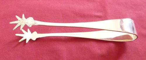 Pair of bird's claw ice tongs