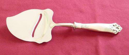 Silver handled cheese slice