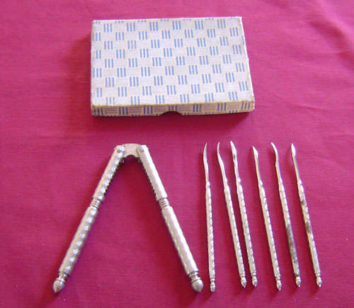 boxed set of silver plated nut picks and nut crackers