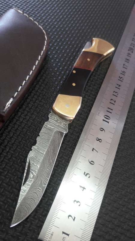 Hand Made DAMASCUS Foldable LOCK Knife, Bull horn and wood handle, Leather pouch included.