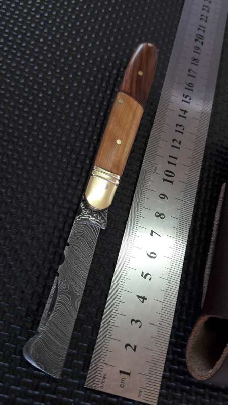 DAMASCUS Hand Made Joseph Rogers style folding knife, two tone wooden handle scales.