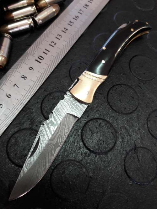 Handmade DAMASCUS  Folding Knife. BULL horn handle scales. Crazy R1 start, No reserve.