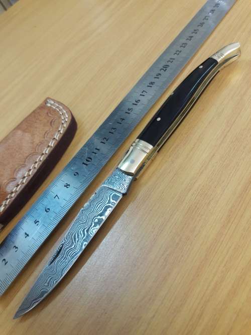 HANDMADE Damascus  steel folding knife with BULL HORN handle scales.