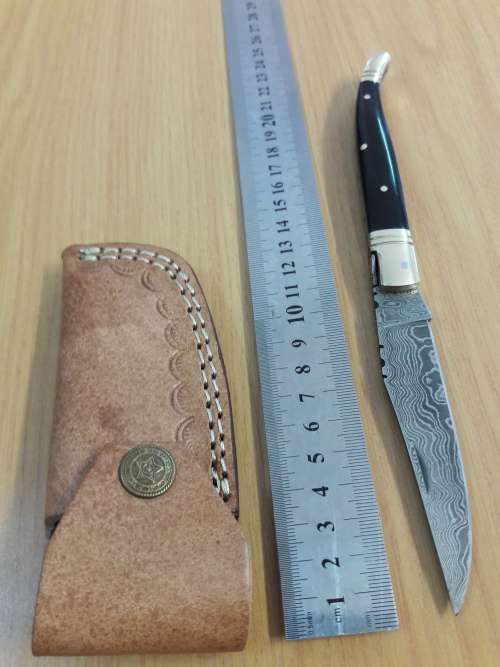 HANDMADE Damascus  steel folding knife with BULL HORN handle scales.