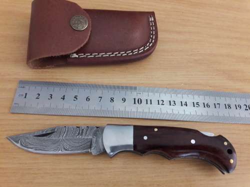 Handmade Damascus steel folding knife with Wooden handle scales.