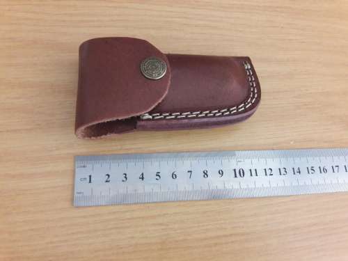 Handmade Damascus steel folding knife with Wooden handle scales.