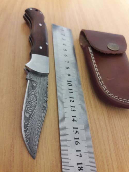 Handmade Damascus steel folding knife with Wooden handle scales.