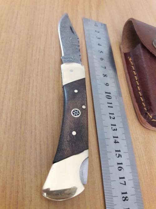 Handmade Damascus steel folding knife with Wooden handle scales. I CAN SEND PARCELS.