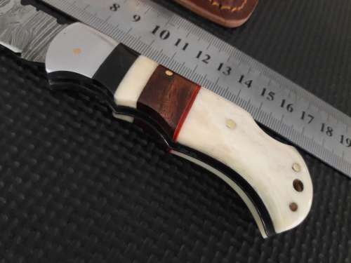 Handmade Damascus steel folding knife with CAMEL BONE and WOODEN handle scales.
