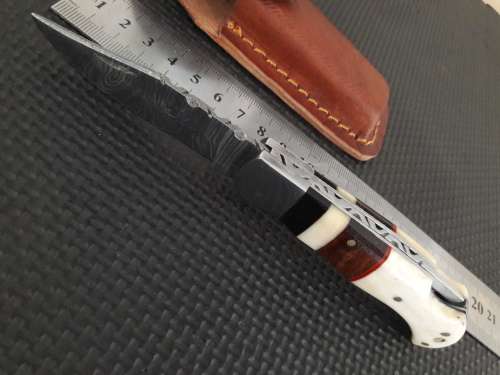Handmade Damascus steel folding knife with CAMEL BONE and WOODEN handle scales.