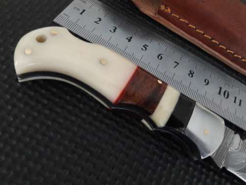 Handmade Damascus steel folding knife with CAMEL BONE and WOODEN handle scales.