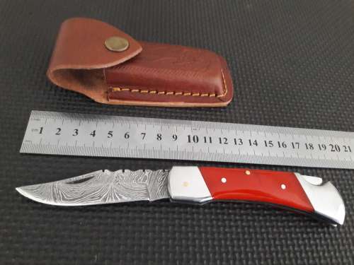 Handmade Damascus steel folding knife with CAMEL BONE handle scales.