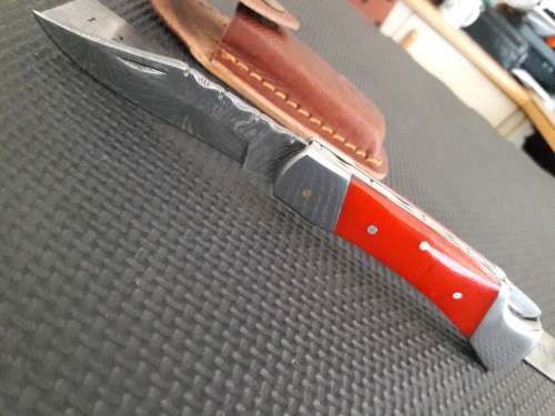 Handmade Damascus steel folding knife with CAMEL BONE handle scales.