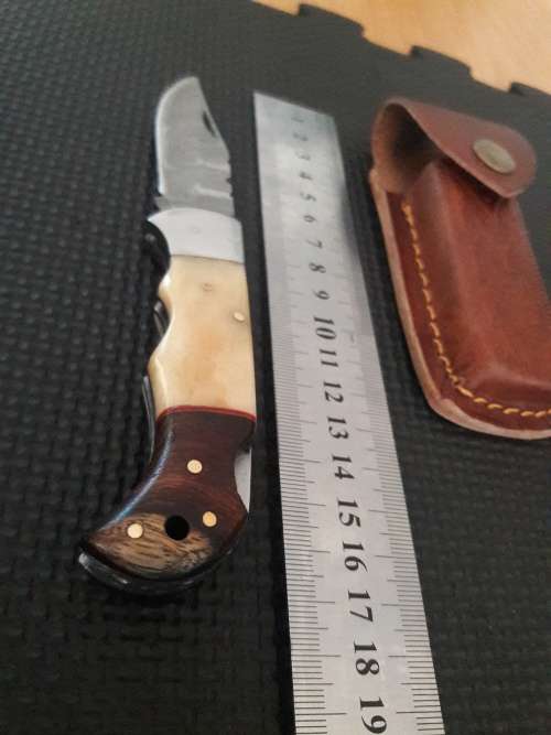 Handmade Damascus steel folding knife with WOOD & CAMEL BONE handle scales.