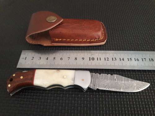 Handmade Damascus steel folding knife with WOOD & CAMEL BONE handle scales.
