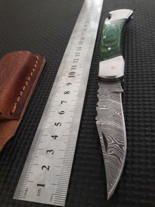 Handmade Damascus steel folding knife with WOOD & CAMEL BONE handle scales.