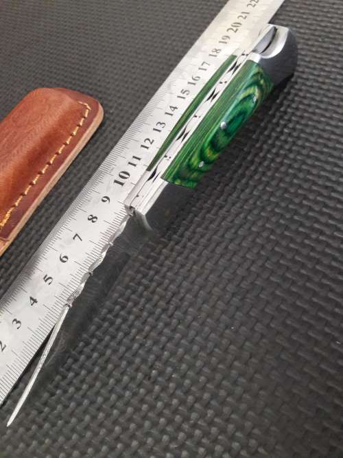 Handmade Damascus steel folding knife with WOOD & CAMEL BONE handle scales.