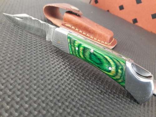 Handmade Damascus steel folding knife with WOOD & CAMEL BONE handle scales.