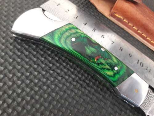 Handmade Damascus steel folding knife with WOOD & CAMEL BONE handle scales.