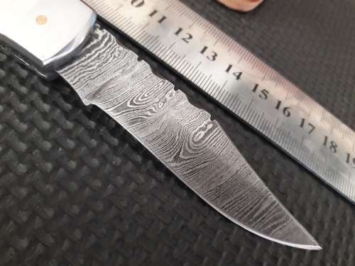 Handmade Damascus steel folding knife with WOOD & CAMEL BONE handle scales.