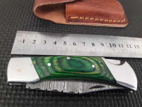 Handmade Damascus steel folding knife with WOOD & CAMEL BONE handle scales.