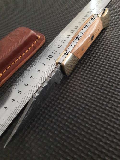 Handmade Damascus steel folding knife with WOODEN handle scales.