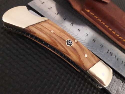 Handmade Damascus steel folding knife with WOODEN handle scales.