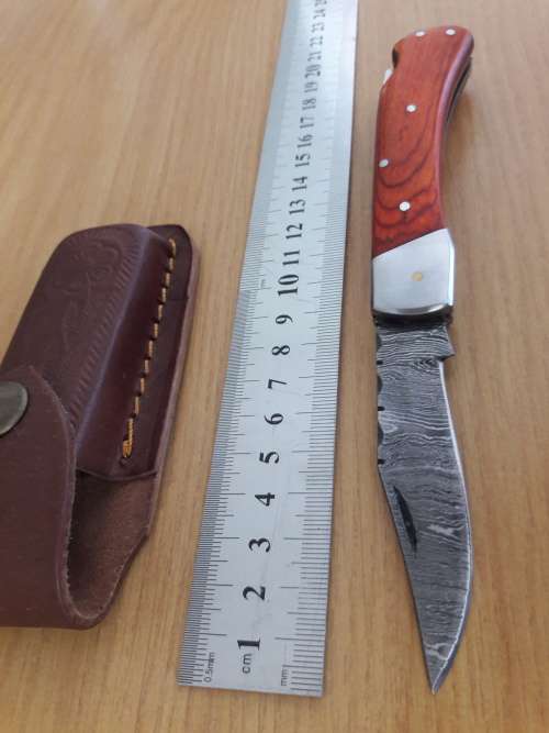 Handmade Damascus steel folding knife with WOODEN handle scales.
