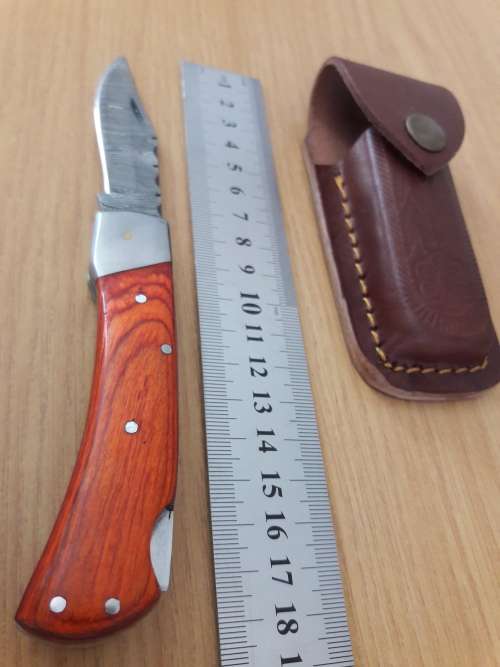 Handmade Damascus steel folding knife with WOODEN handle scales.